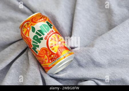 KYIV, UKRAINE - 4 MAY, 2023: Mirinda orange drink in orange citrus tin can with classic design and logo close up Stock Photo