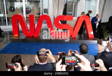 The NASA Worm Logo sign is unveiled before the ribbon cutting ceremony to open NASA’s Earth Information Center, Wednesday, June 21, 2023, at the Mary W. Jackson NASA Headquarters building in Washington. The Earth Information Center is new immersive experience that combines live data sets with cutting-edge data visualization and storytelling to allow visitors to see how our planet is changing.  Photo Credit: (NASA/Joel Kowsky) Stock Photo