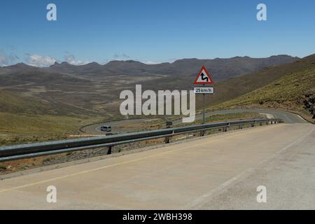 African taxi van travelling on mountain pass, rural landscape Kingdom of Lesotho, Africa road infrastructure, rugged terrain Maloti mountains Stock Photo
