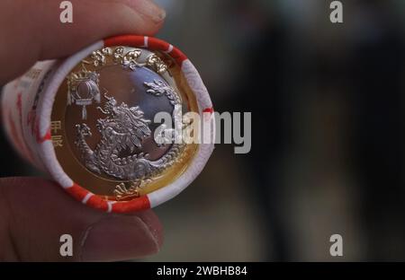 The 2024 New Year commemorative coins are issued in Hangzhou City, east China's Zhejiang Province, 9 January, 2024. Stock Photo