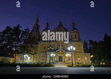 View of the side facade at dusk, evening with glowing sky. At the Ascension, Zenkov wood cathedral in Panfilov park. In Almaty, Kazakhstan. Stock Photo