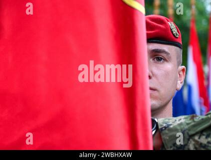 Croatian soldier with national flag. Army of Republic of Croatia. Armed Forces of Croatia. Stock Photo