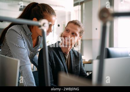 Software engineers working together on project at tech startup. Business designers working together Stock Photo