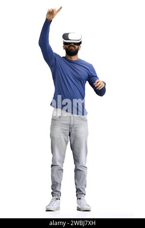 Man, on a white background, full-length, wearing VR glasses Stock Photo