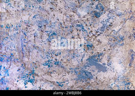 Aged old gray and white with blue strokes cement wall with uneven background, textured. Rough background. Copy space Stock Photo