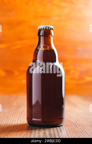 Bottle of beer on the wooden table. Stock Photo
