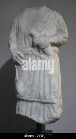 Statue of a young man carrying an offering (a bird). Dated around the 2nd century AD. From the Roman temple of Endovelicus at Sao Miguel da Mota. Terena, Alandroal, Evora. Portugal. National Archaeology Museum. Lisbon, Portugal. Stock Photo