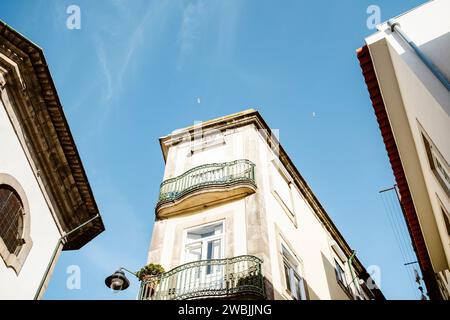 Interesting view of Porto architecture - looking up toward the blue sky, Portugal Stock Photo
