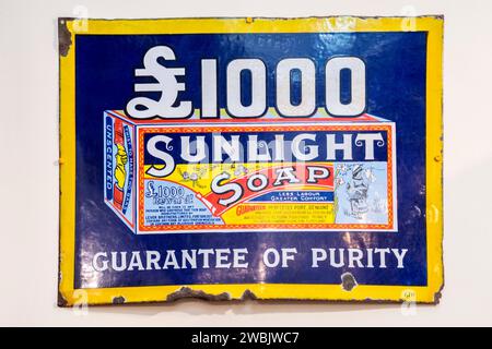 An old enamel metal sign advertising Sunlight Soap. Stock Photo