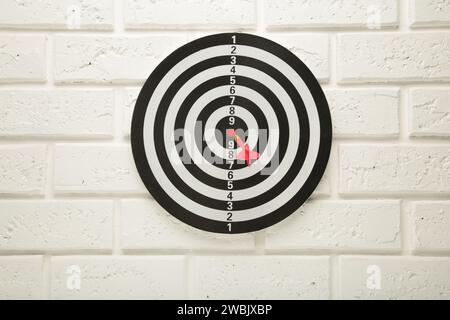 Darts Board on the white wall background. Top view. Stock Photo
