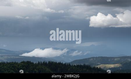 Downpour over mountain with gloomy clouds, view from Vlasic mountain Stock Photo