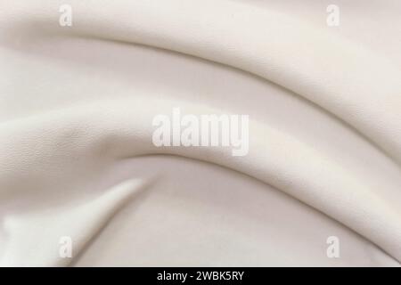 White leather texture with waves, used as a luxurious classic background. Texture and backgrounds Stock Photo
