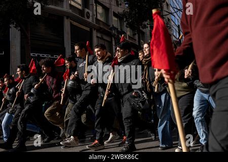 Athen, Greece. 11th Jan, 2024. Students march through the streets chanting slogans during a demonstration against the planned approval of private universities, including: 'No to private universities', 'Hands off our education' and 'Education must remain free for all'. Student associations and the teachers' union OLME had called for the protests. Credit: Socrates Baltagiannis/dpa/Alamy Live News Stock Photo