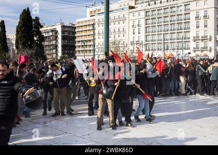 Athen, Greece. 11th Jan, 2024. Students protect themselves from tear gas during clashes with the police during a demonstration against the planned admission of private universities. Student associations and the teachers' union OLME had called for the protests. Credit: Socrates Baltagiannis/dpa/Alamy Live News Stock Photo