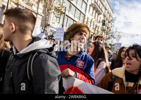 Athen, Greece. 11th Jan, 2024. Students march through the streets chanting slogans during a demonstration against the planned approval of private universities, including: 'No to private universities', 'Hands off our education' and 'Education must remain free for all'. Student associations and the teachers' union OLME had called for the protests. Credit: Socrates Baltagiannis/dpa/Alamy Live News Stock Photo