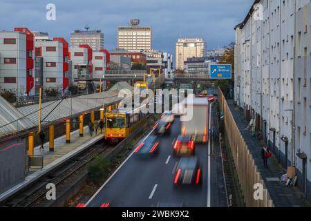 Essen, North Rhine-Westphalia, Germany - Autobahn A40 in the city center, exit Essen Zentrum, during evening twilight. Subway line U18 on the way to B Stock Photo
