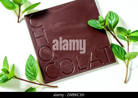 chocolate bar with the inscription "chocolate" and fresh mint Stock Photo