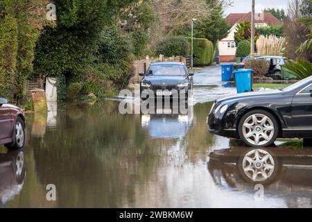 Wraysbury, UK. 11th January, 2024. Some gardens remain flooded in Wraysbury, Berkshire after the River Thames burst its banks earlier this week. After a terrible week for some residents near the River Thames the flooding is finally subsiding in Wraysbury, Berkshire. Now the clean up begins. Credit: Maureen McLean/Alamy Live News Stock Photo