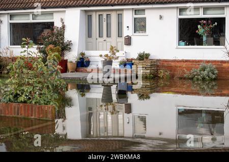 Wraysbury, UK. 11th January, 2024. Some gardens remain flooded in Wraysbury, Berkshire after the River Thames burst its banks earlier this week. After a terrible week for some residents near the River Thames the flooding is finally subsiding in Wraysbury, Berkshire. Now the clean up begins. Credit: Maureen McLean/Alamy Live News Stock Photo