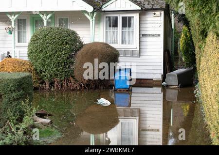 Wraysbury, UK. 11th January, 2024. Some gardens remain flooded in Wraysbury, Berkshire after the River Thames burst its banks earlier this week. After a terrible week for some residents near the River Thames the flooding is finally subsiding in Wraysbury, Berkshire. Now the clean up begins. Credit: Maureen McLean/Alamy Live News Stock Photo