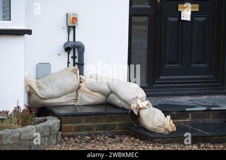 Wraysbury, UK. 11th January, 2024. Some gardens remain flooded in Wraysbury, Berkshire after the River Thames burst its banks earlier this week. After a terrible week for some residents near the River Thames the flooding is finally subsiding in Wraysbury, Berkshire. Now the clean up begins. Credit: Maureen McLean/Alamy Live News Stock Photo