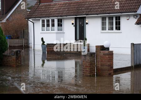 Wraysbury, UK. 11th January, 2024. Some gardens remain flooded in Wraysbury, Berkshire after the River Thames burst its banks earlier this week. After a terrible week for some residents near the River Thames the flooding is finally subsiding in Wraysbury, Berkshire. Now the clean up begins. Credit: Maureen McLean/Alamy Live News Stock Photo