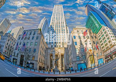 NEW YORK, USA-MARCH 6, 2020:Atlas, a bronze statue in Rockefeller Center, Midtown Manhattan. It is across on Fifth Avenue with St. Patrick's Cathedral Stock Photo