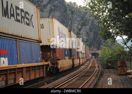 Here is a photo of a double stack intermodal CSX train passing through Harpers Ferry, WV. Stock Photo