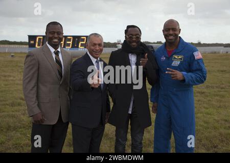 CAPE CANAVERAL, Fla. – From left, Yves Lamothe, lead systems engineer for the 21st Century Ground Systems Program at NASA Kennedy Space Center; NASA Administrator Charles Bolden; Will.i.am, entertainer and member of The Black Eyed Peas; and former astronaut Leland Melvin, NASA associate administrator for Education, take part in a Tweetup at NASA Kennedy Space Center's Press Site in Florida during prelaunch activities for the agency’s Mars Science Laboratory (MSL) launch.  Behind them, the countdown clock ticks off the seconds to launch. Participants in the Tweetup are given the opportunity to Stock Photo