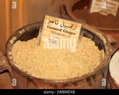 A rustic jar of ground yellow ginger. Stock Photo
