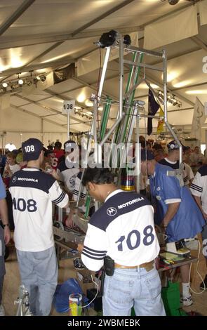 Students from Plantation, Fla., and their mentors prepare their team robot to compete in the NASA KSC FIRST Southeastern Regional event. FIRST (For Inspiration and Recognition of Science and Technology) events are held nationwide, pitting the student-built robots against each other and the clock on a playing field. Many teams are sponsored by corporations, such as Motorola seen on these students’ shirts, and academic institutions. There are 27 teams throughout the State of Florida who are competing. KSC, which sponsors nine teams, has held the regional event for two years. Stock Photo