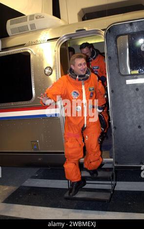 KENNEDY SPACE CENTER, Fla. -- Expedition 4 Commander Yuri Onufrienko steps down from the Astrovan after returning from Space Shuttle Endeavour. The launch of STS-108 was delayed by one day Dec. 4, 2001, due to poor weather at Kennedy. Space Shuttle Endeavour is now scheduled to lift off at 5 19 p.m. EST (2219 GMT) Dec. 5 Stock Photo