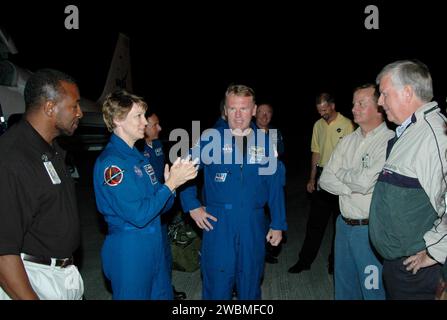 KENNEDY SPACE CENTER, FLA. - After arrival at NASA’s Kennedy Space Center, the STS-114 crew members are greeted by KSC officials. Seen from left are Deputy Director Woodrow Whitlow Jr., Commander Eileen Collins, Mission Specialists Charles Camarda (behind Collins) and Andrew Thomas, astronaut Jerry Ross, who is chief of the Vehicle Integration Test (VIT) office, VIT Lead for STS-114 Robert Hanley, Shuttle Launch Director Mike Leinbach and Center Director Jim Kennedy. Crew members are taking part in the Terminal Countdown Demonstration Test (TCDT) over the next three days. The TCDT is held at K Stock Photo