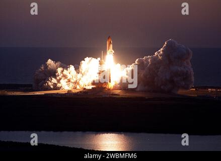 KENNEDY SPACE CENTER, Fla. -- Viewed from the top of the Vehicle Assembly Building, Space Shuttle Discovery leaps from the Earth against the background of the Atlantic Ocean on mission STS-102. Liftoff at dawn occurrred at 6 42 09 EST for the eighth flight to the International Space Station Stock Photo