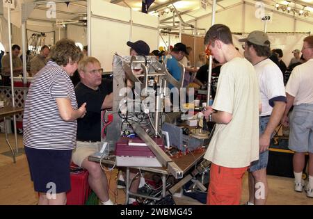 Students and their mentors prepare their team robot to compete in the NASA KSC FIRST Southeastern Regional event. FIRST (For Inspiration and Recognition of Science and Technology) events are held nationwide, pitting the student-built robots against each other and the clock on a playing field. Many teams are sponsored by corporations and academic institutions. There are 27 teams throughout the State of Florida who are competing. KSC, which sponsors nine teams, has held the regional event for two years. Stock Photo