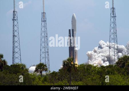 CAPE CANAVERAL, Fla. -- NASA's Juno planetary probe, enclosed in its payload fairing, begins its five-year journey to Jupiter atop a United Launch Alliance Atlas V-551 launch vehicle from Space Launch Complex 41 on Cape Canaveral Air Force Station in Florida.  Liftoff was at 12:25 p.m. EDT Aug. 5. The solar-powered spacecraft will orbit Jupiter's poles 33 times to find out more about the gas giant's origins, structure, atmosphere and magnetosphere and investigate the existence of a solid planetary core. NASA's Jet Propulsion Laboratory, Pasadena, Calif., manages the Juno mission for the princi Stock Photo