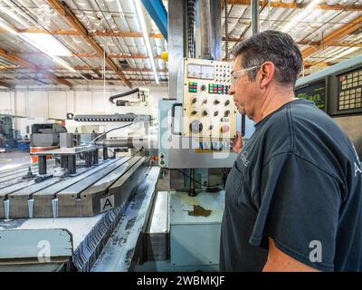 Parts for the Orion crew module which will carry astronauts on Artemis II are machined at Aerospace Engineering Corporation in California on June 18, 2018. Stock Photo