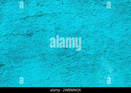Abstract texture of blue old cracked stucco. High quality photo . Wall with old turquoise plaster close-up. Stock Photo