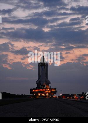 CAPE CANAVERAL, Fla. – In the early morning hours, space shuttle Atlantis rolls out to Launch Pad 39A at NASA's Kennedy Space Center in Florida after rollout from the Vehicle Assembly Building.  The shuttle sits atop the mobile launcher platform, which is carried by the crawler-transporter beneath. First motion was at 3:54 a.m. EDT and Atlantis was secured on the pad at 11:17 a.m. The 3.4-mile trip took about seven-and-a-half hours. Atlantis is targeted to lift off May 12 to service NASA's Hubble Space Telescope. During Atlantis' 11-day mission, the crew of seven astronauts will make the final Stock Photo