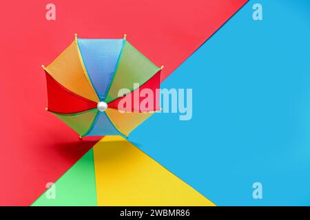 Colorful mini umbrella on color background Stock Photo
