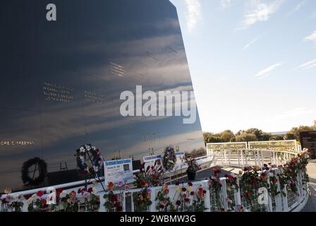 CAPE CANAVERAL, Fla. -- Kennedy Space Center Employees and guests placed wreaths and flowers at the Space Mirror Memorial at the spaceport's Visitor Complex during NASA's Day of Remembrance. The annual event took place on the 10th anniversary of the loss of the space shuttle Columbia and its crew and was hosted by the Astronauts Memorial Foundation. The ceremony also honored the astronauts of Apollo 1, who perished in 1967, and the shuttle Challenger, lost in 1986, as well as other astronauts who lost their lives while furthering the cause of exploration and discovery. Dedicated in 1991, the n Stock Photo