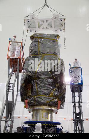 CAPE CANAVERAL, Fla. – At the Astrotech Space Operations facility in Titusville, Fla., technicians from NASA's Goddard Space Flight Center attach a lifting device to the bagged Solar Dynamics Observatory, or SDO, during preparations to remove it from a Ransome table.  SDO is the first space weather research network mission in NASA's Living With a Star Program. The spacecraft's long-term measurements will give solar scientists in-depth information about changes in the sun's magnetic field and insight into how they affect Earth. Liftoff on an Atlas V rocket is scheduled for Feb. 3, 2010. Stock Photo