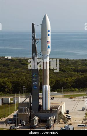 CAPE CANAVERAL, Fla. -- NASA's Juno spacecraft, enclosed in its payload fairing atop a United Launch Alliance Atlas V-551 launch vehicle, stands on its seaside launch pad at Space Launch Complex 41 on Cape Canaveral Air Force Station in Florida.  The water of the Atlantic Ocean swirls in the distance.  Launch is planned during a launch window which extends from 11:34 a.m. to 12:43 p.m. EDT on Aug. 5. The solar-powered spacecraft will orbit Jupiter's poles 33 times to find out more about the gas giant's origins, structure, atmosphere and magnetosphere and investigate the existence of a solid pl Stock Photo