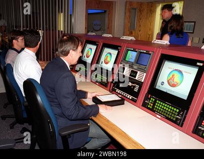 The upgraded Launch Vehicle Data Center at Hangar AE, Cape Canaveral, features three control rooms replacing the previous LVDC. It supports multiple test operations, allowing up to 100 engineers to monitor voice, data, and video systems for checkout and launch of expendable vehicles. Steve Francois, program manager for Expendable Vehicles, attended the dedication. Stock Photo