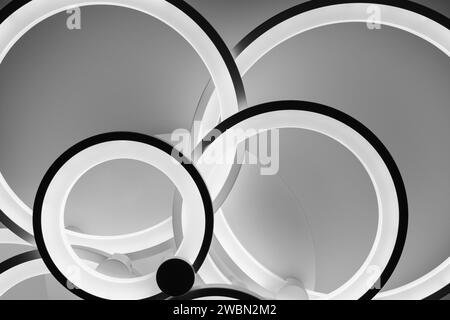 Luminous modern LED ring lamp on the ceiling. Bottom view. Stock Photo
