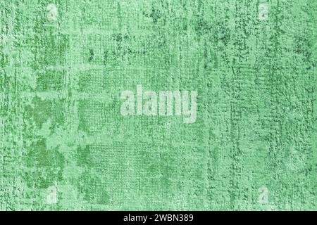Texture of a natural green carpet with an abstract pattern, close-up. Modern carpet, carpet fabric background, design, floor carpet, interior design Stock Photo