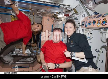 S132-E-009158  (22 May 2010) --- Two thirds of the Expedition 23 crew, which is hosting six Atlantis STS-132 astronauts for approximately a week of shared work on the International Space Station, will be joining two crewmates out of frame in saying farewell to the shuttle crew tomorrow,  May 23.  In the Unity node’s  foreground are, from left, Japan Aerospace Exploration Agency astronaut Soichi Noguchi, along with NASA astronauts T.J. Creamer and Tracy Caldwell Dyson, all flight engineers.  Russian cosmonaut Alexander Skvortsov, Expedition 23 flight engineer, can be seen, partially obscured, i Stock Photo