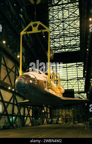 Space Shuttle Discovery is lifted to vertical in the Vehicle Assembly ...
