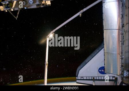 The Space Shuttle Atlantis backdropped over a colourful Earth Stock ...