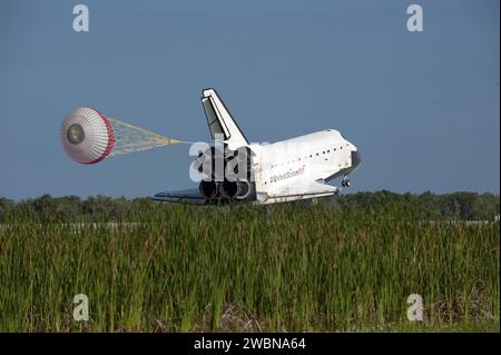 Space shuttle Atlantis deploys its drag chute while rolling to a stop ...